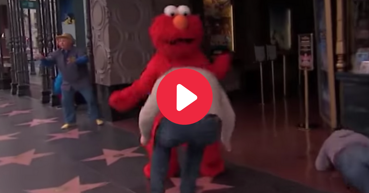 elmo riding a bike