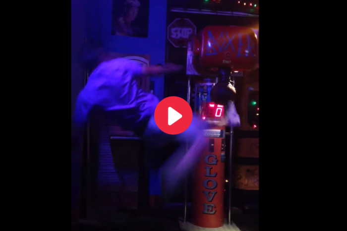 WATCH: Drunk Guy Hilariously Fails at Kicking Arcade Punching Machine