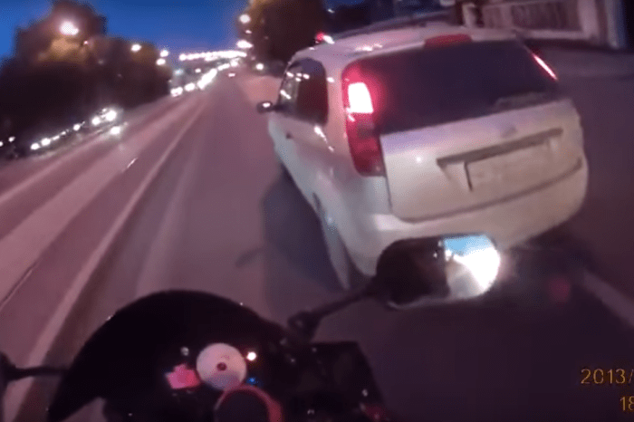 Road raging biker gets what he deserves when he messes with the wrong car