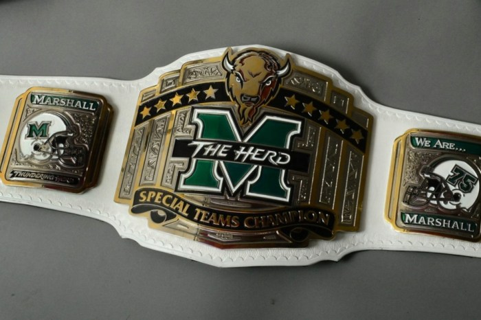Marshall football has new team trophies in the form of wrestling title belts