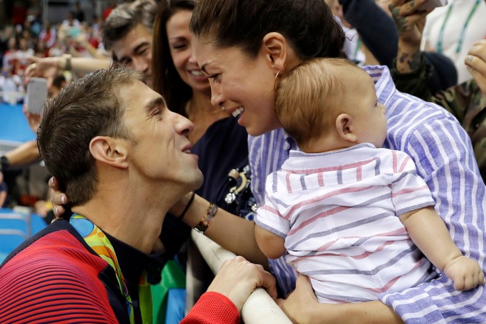 Michael Phelps tears up on camera as he discusses “very special” medal moment with his son