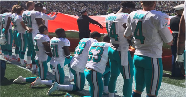 While the Seahawks linked arms, Arian Foster and the Dolphins knelt during the national anthem