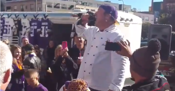 Psycho Vikings fan hyped a tailgate by biting the head off of multiple fish