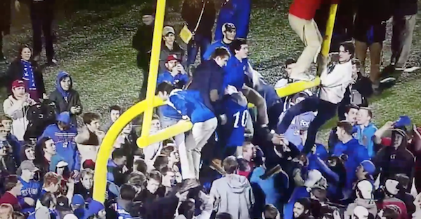 All hell broke loose after Kansas’ upset of Texas as fans ripped the goal posts down