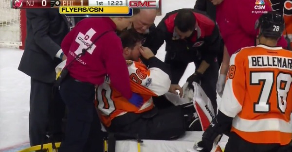Hockey player inexplicably collapsed on the ice as medical personnel rushed to his side
