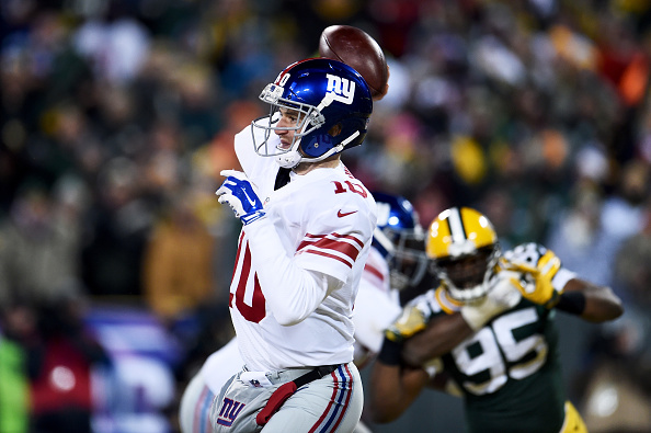 GREEN BAY, WI - JANUARY 8: Eli Manning #10 of the New York Giants throws a pass in the third quarter during the NFC Wild Card game against the Green Bay Packers at Lambeau Field on January 8, 2017 in Green Bay, Wisconsin. (Photo by Stacy Revere/Getty Images)