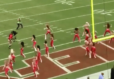 Cameraman Levels NFL Cheerleader, And She Takes It Like a Champ