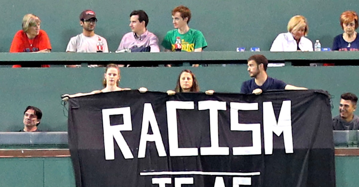 Fans drape 'Racism is as American as baseball' sign over Green Monster