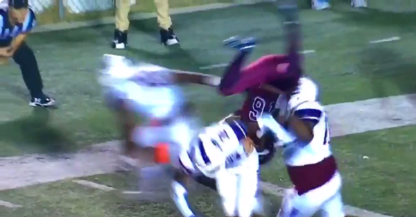 QB gets flipped and slammed into oblivion on a 2-point conversion attempt