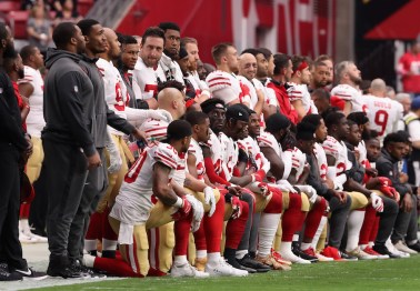 Team releases statement after nearly 30 players kneel for national anthem