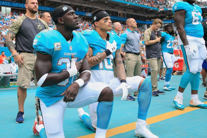 Less than a month after instituting national anthem policy, three players reverse course