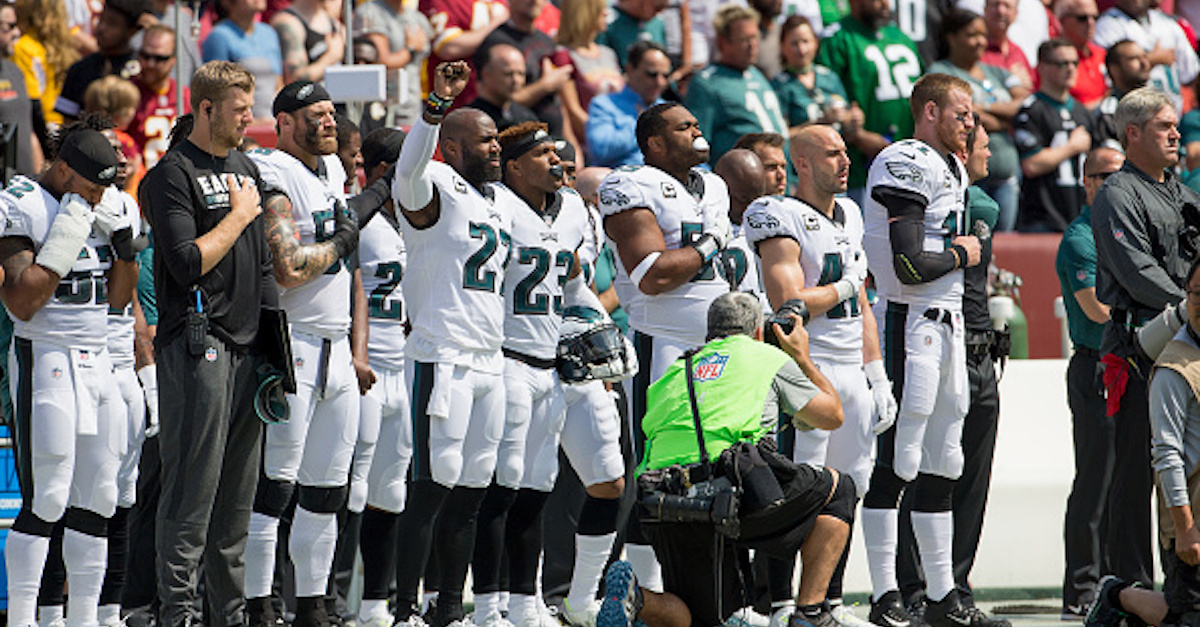 After blockbuster agreement, national anthem protesting NFL player plans to halt demonstration
