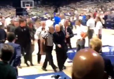 Cincinnati coach has to be restrained from going after a player after Crosstown Shootout loss