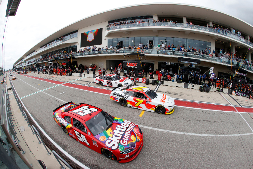 Kyle Busch and Justin Allgaier exit pit road during the NASCAR Xfinity Series Pit Boss 250 at Circuit of The Americas on May 22, 2021