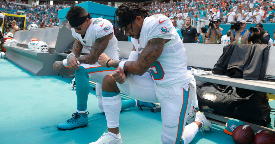 Dolphins Players Kneeling