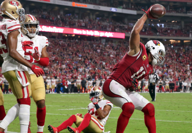 Larry Fitzgerald Uses Hilarious Dad Logic to Explain First-Ever Football Spike