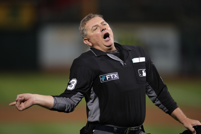 Home Plate Umpire Greg Bench ejects the Oakland Athletic's Bench Coach during a game in 2021