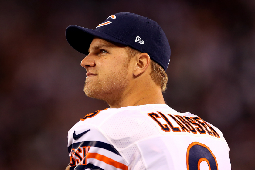 Jimmy Clausen looks up at the scoreboard during a Chicago Bears game. 