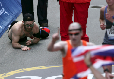 WATCH: Marine Heroically Crawls over Boston Marathon Finish Line