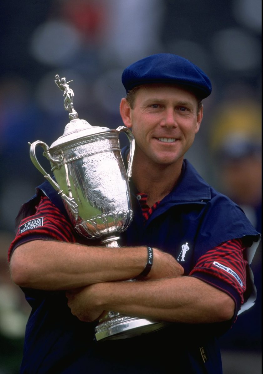 Payne Stewart of the United States celebrates victory with the trophy after winning the 1999 US Open Tournament