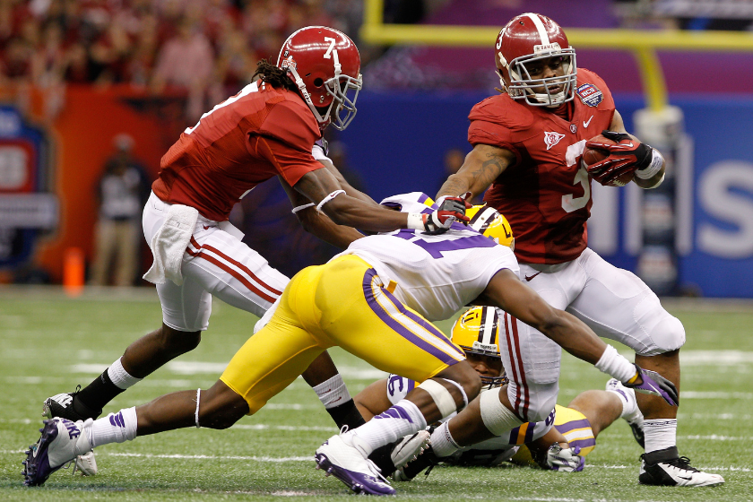 Trent Richardson #3 of the Alabama Crimson Tide runs the ball against Morris Claiborne #17 of the Louisiana State University Tigers during the 2012 Allstate BCS National Championship Game