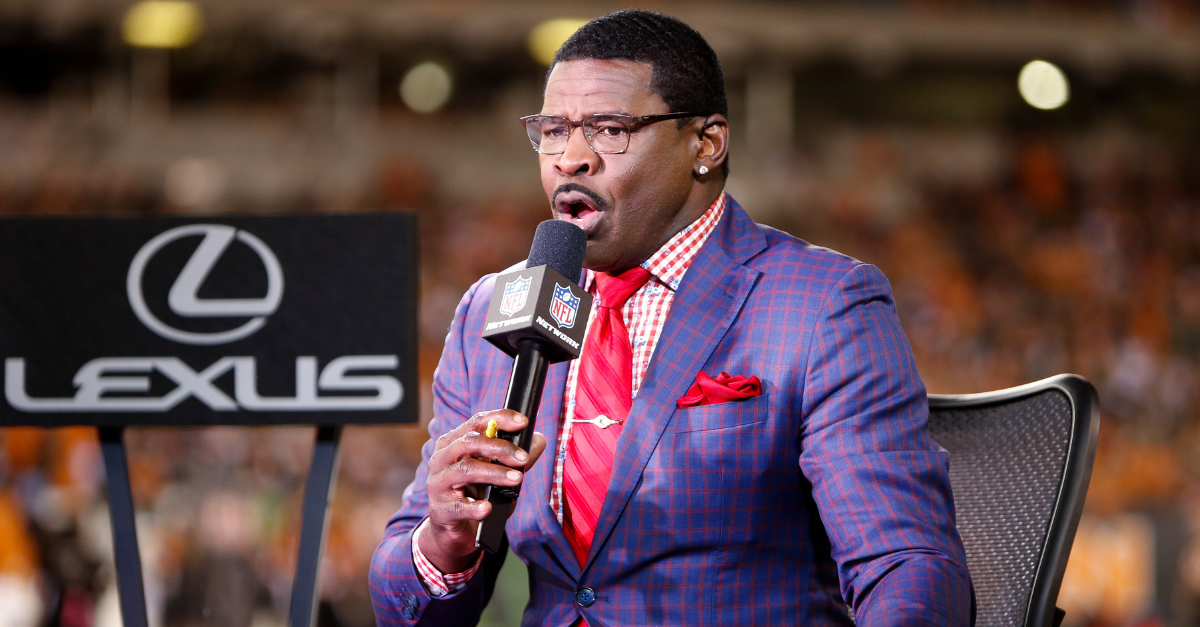 What did Michael Irvin do with his first paycheck from the Cowboys