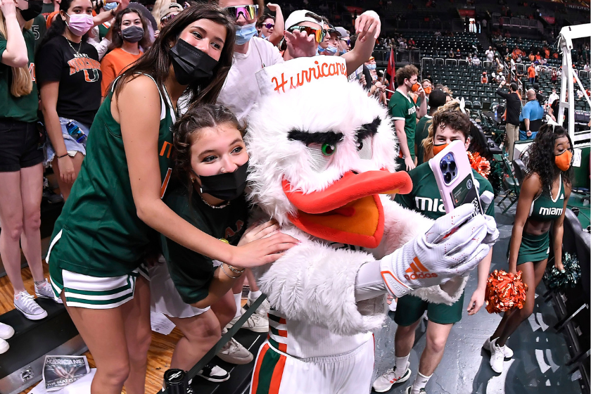 Miamis mascot, Sebastian the Ibis, takes a selfie with students as the University of Miami Hurricanes faced the Florida State University Seminoles