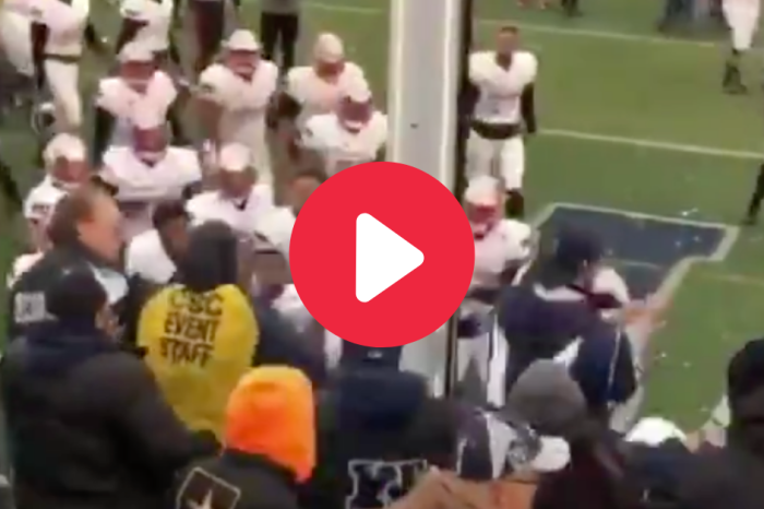 Player Swings Helmet at Angry Fans During Rivalry Game Brawl