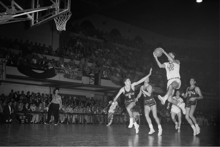 LSU center Bob Pettit takes off for a shot against Fordham.