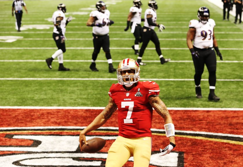 Colin Kaepernick celebrates after he scored a 15-yard rushing touchdown in the fourth quarter against the Baltimore Ravens during Super Bowl XLVII.
