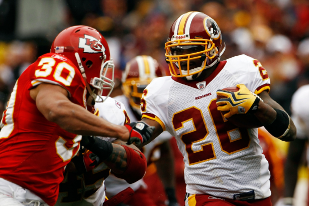 Clinton Portis gets tackled during a 2009 NFL game.