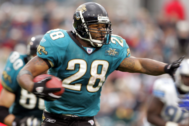 Fred Taylor stiff arms a player during a 2004 NFL game.