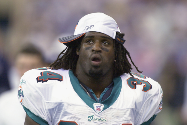 Ricky Williams looks on during a 2002 NFL game.
