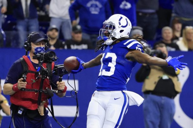 TY Hilton celebrates a touchdown against the Raiders in 2022.