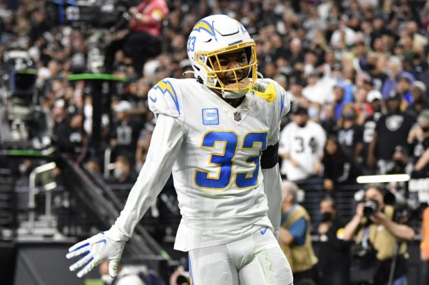 Derwin James celebrates an incompletion against the Raiders in 2022.