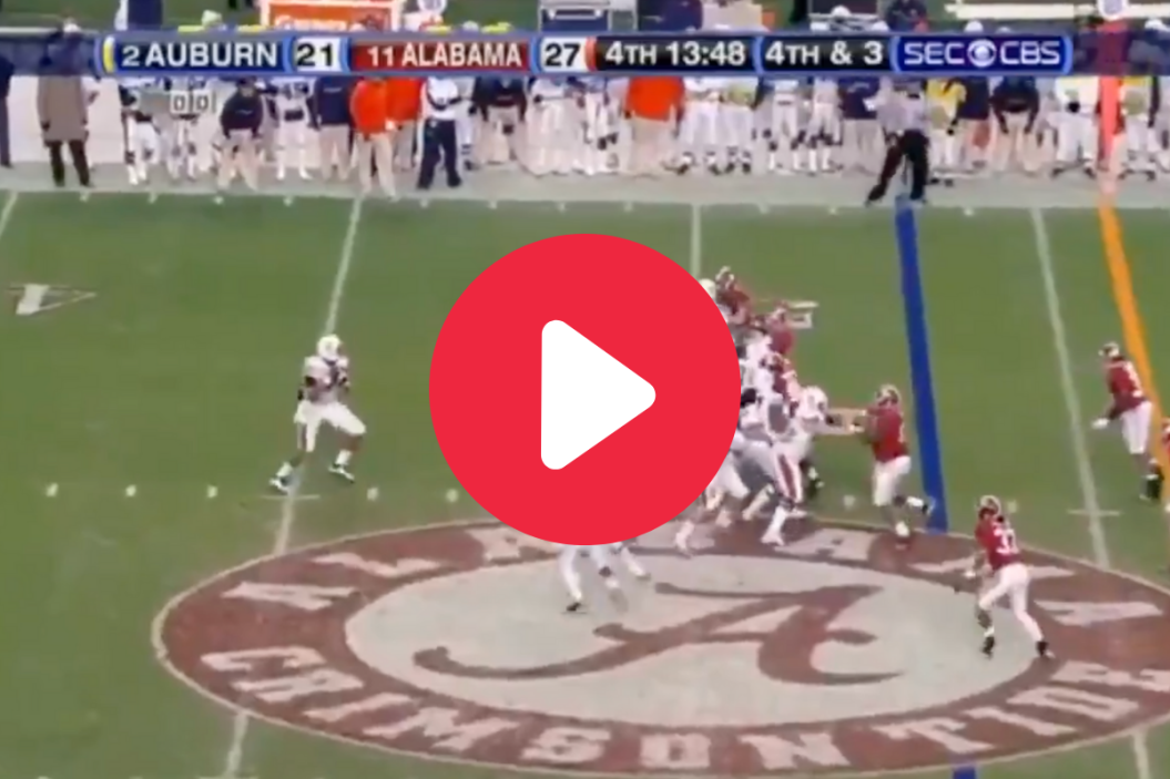 Cam Newton drops back to pass against Alabama in 2010.