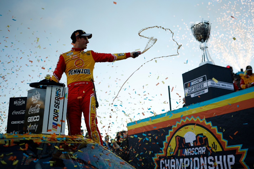 Joey Logano celebrates in victory lane after winning the 2022 NASCAR Cup Series Championship at Phoenix Raceway