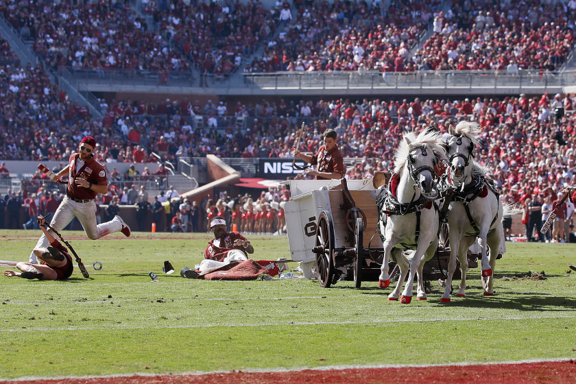 Oklahoma Ruf Nek's Sooner Schooner over turns after a touchdown celebration during a college football game between the Oklahoma Sooners and the West Virginia Mountaineers
