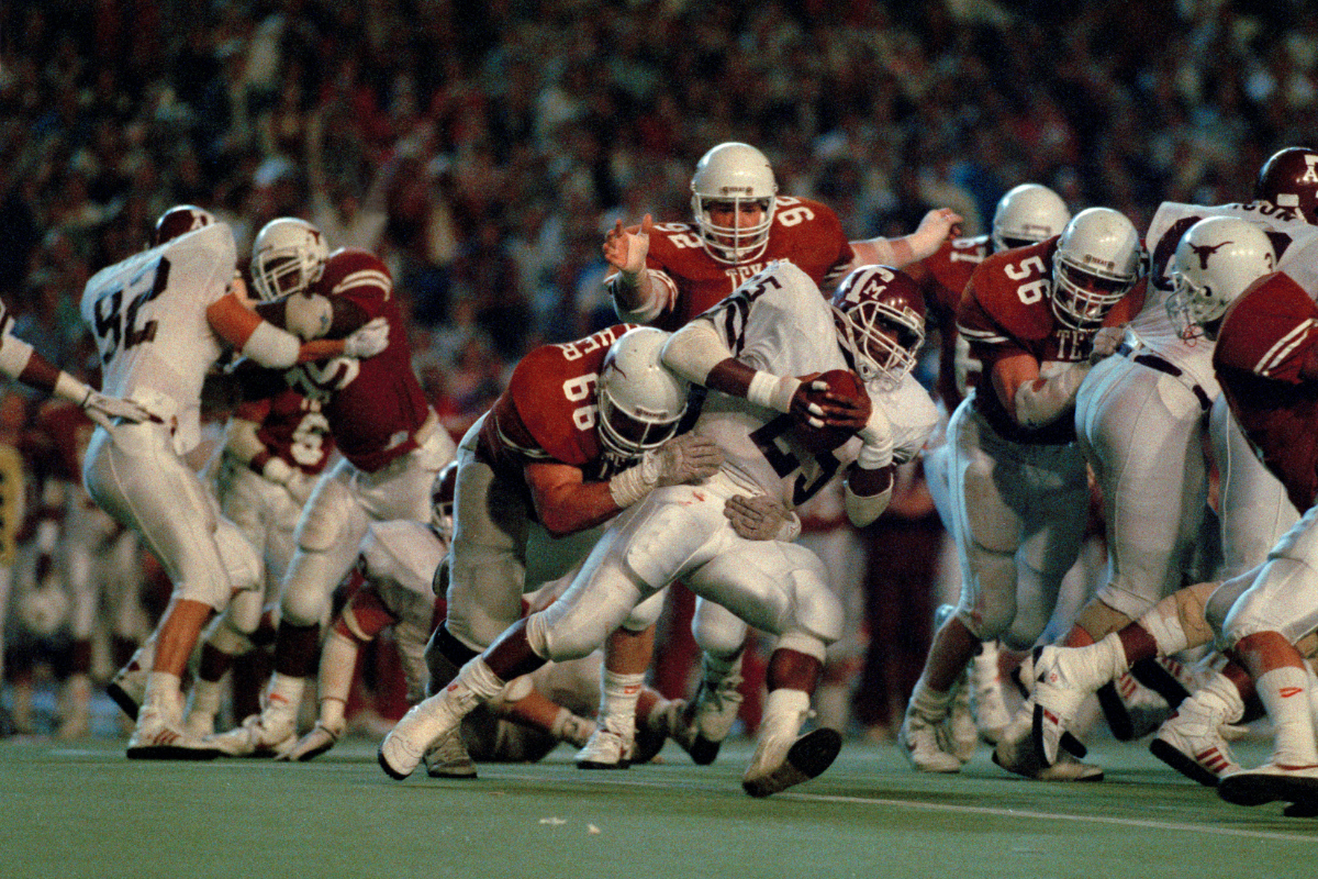 Darren Lewis runs through a tackle against Texas in 1988.