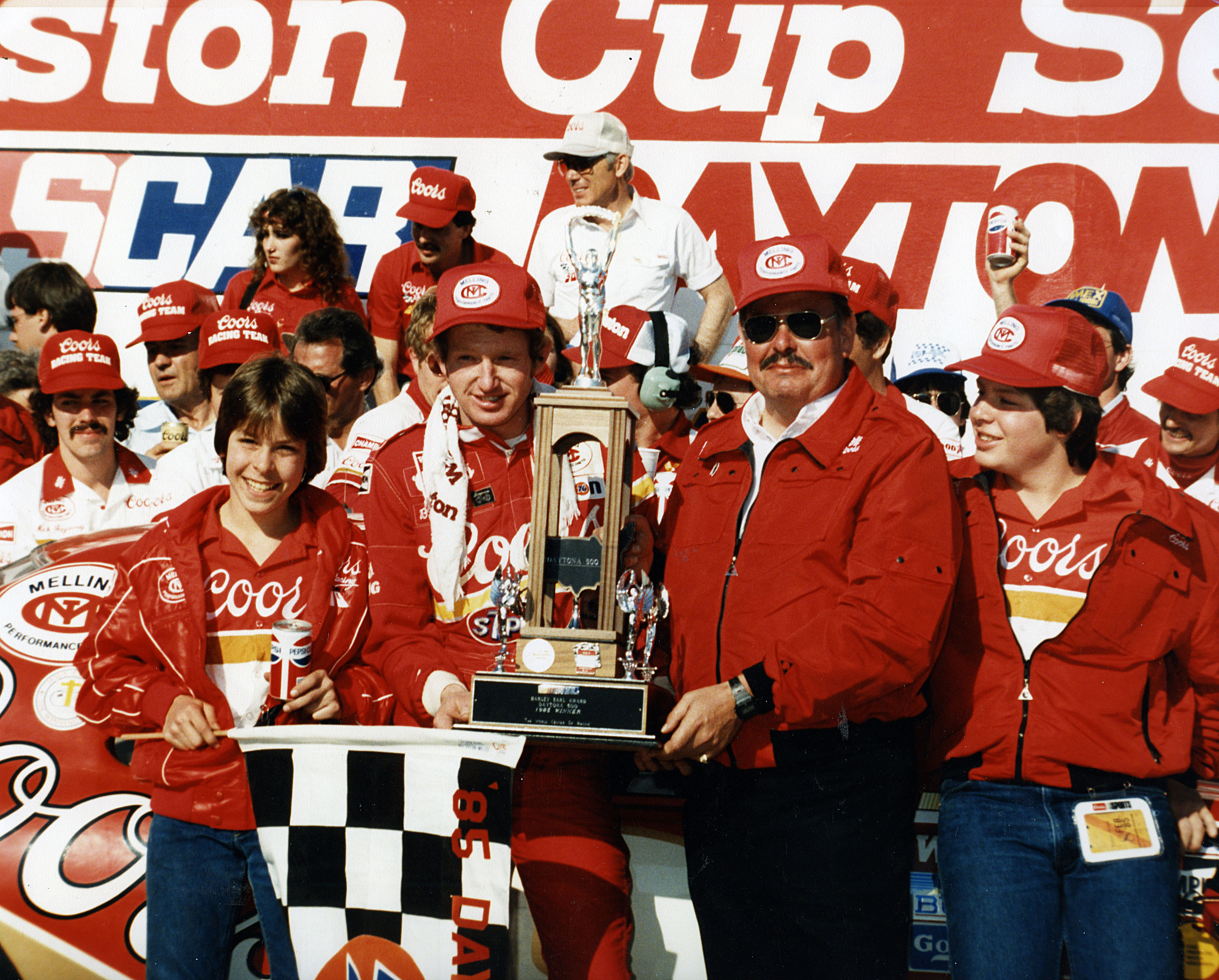 Driver Bill Elliott and his car owner Harry Melling are joined by Melling's sons Matt (far left) and Mark (far right) after Elliott won the Daytona 500 NASCAR Cup race at Daytona International Speedway