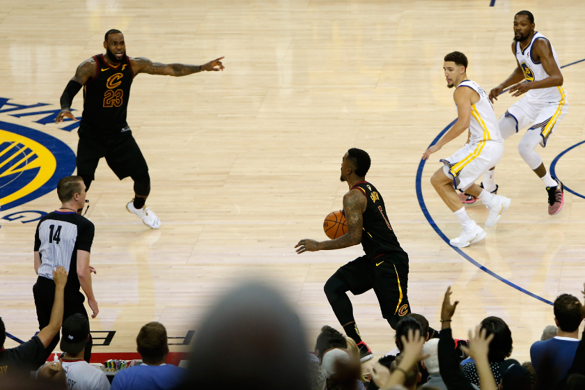LeBron James signals to the JR Smith during the final seconds of regulation in Game 1 of the 2018 NBA Finals