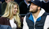 Matthew Stafford and Kelly Stafford attend a sporting event together.