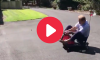 Nick Saban rides a tiny go-kart.