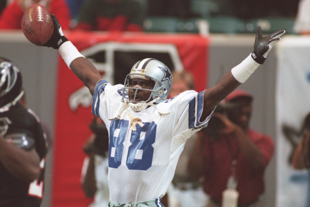 Michael Irvin celebrates after scoring a touchdown against the Atlanta Falcons.