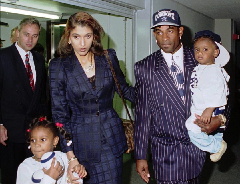 Deion Sanders walks with this first wife Carolyn Chambers.