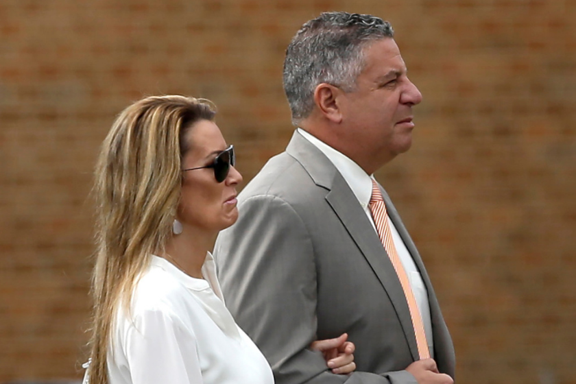 Auburn basketball coach Bruce Pearl and his wife Brandi attend the funeral of Charles Barkley's mother, Charcey Glenn.