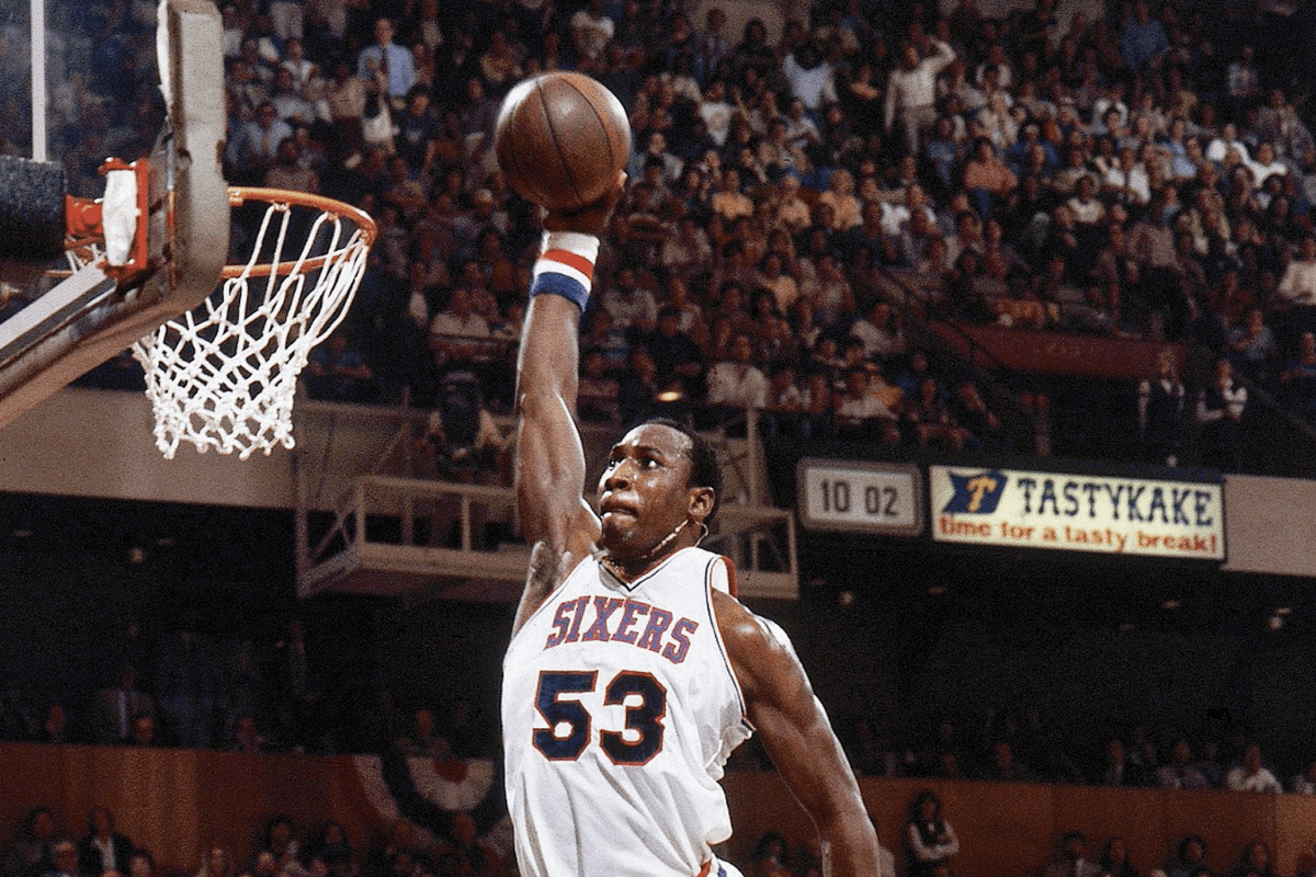 Darryl Dawkins dunks during a 1980 NBA game.