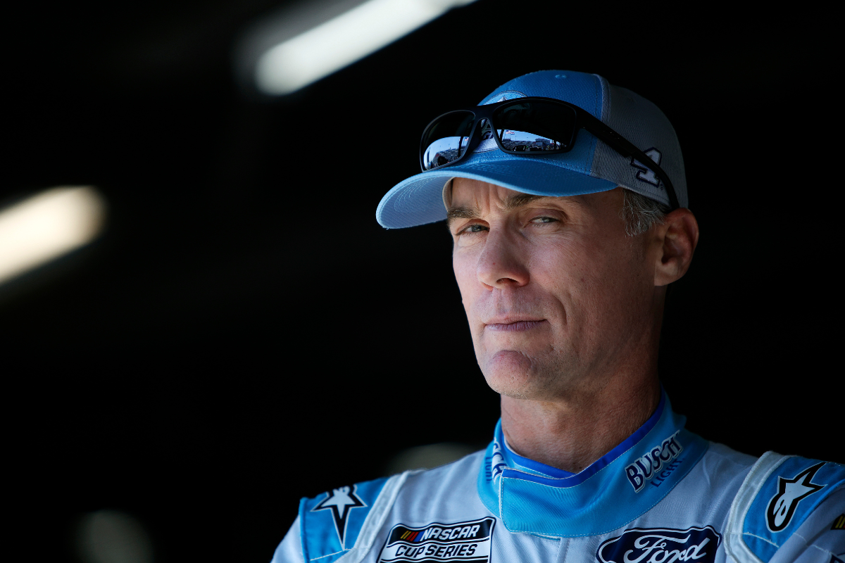Kevin Harvick waits in the garage area during practice for the 2022 Enjoy Illinois 300 at WWT Raceway