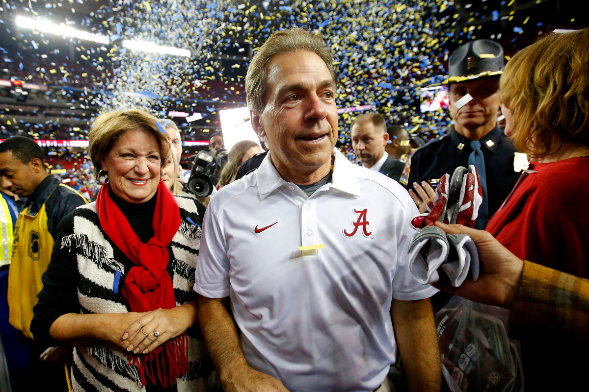 Alabama head coach Nick Saban celebrates the 2015 SEC Championship with his wife Miss Terry.