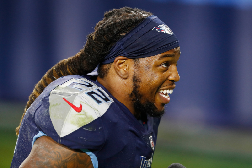 Derrick Henry smiles during an NFL game.